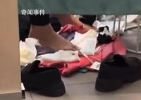 HM回应女子试衣用新衣垫脚 引起广泛关注