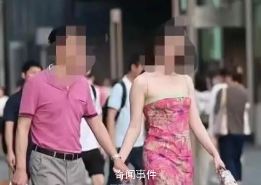 摄影师回应街拍国企领导与女子牵手 目前视频已删除