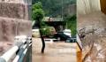 重庆暴雨:路旁现“瀑布” 车辆被淹