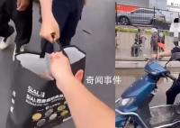 深圳保安夺走商贩盒饭摔在地上 引发网友热议