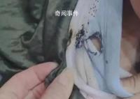 天降烟头6岁男童棉衣被烫穿 差点烧伤到了皮肤